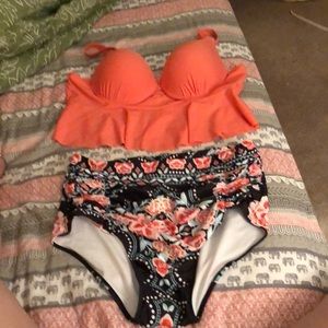 Coral peplum top with a high waisted floral bottom